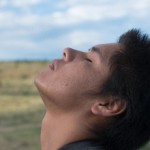 Young man looking to the sky