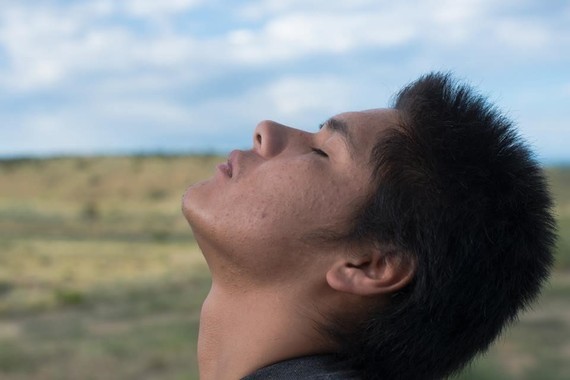 Young man looking to the sky